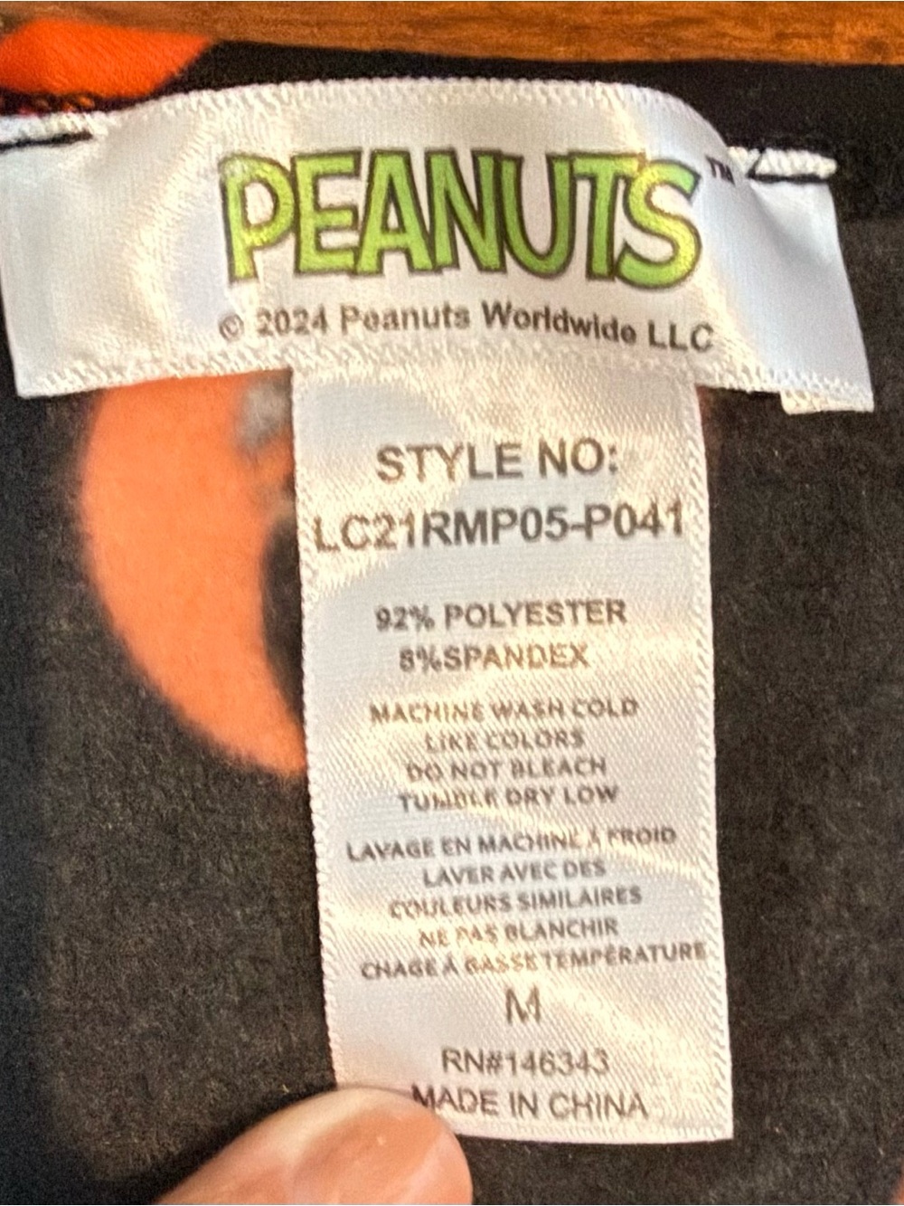 Peanuts Black and Orange Graphic One-Piece Romper - Picture 3 of 3